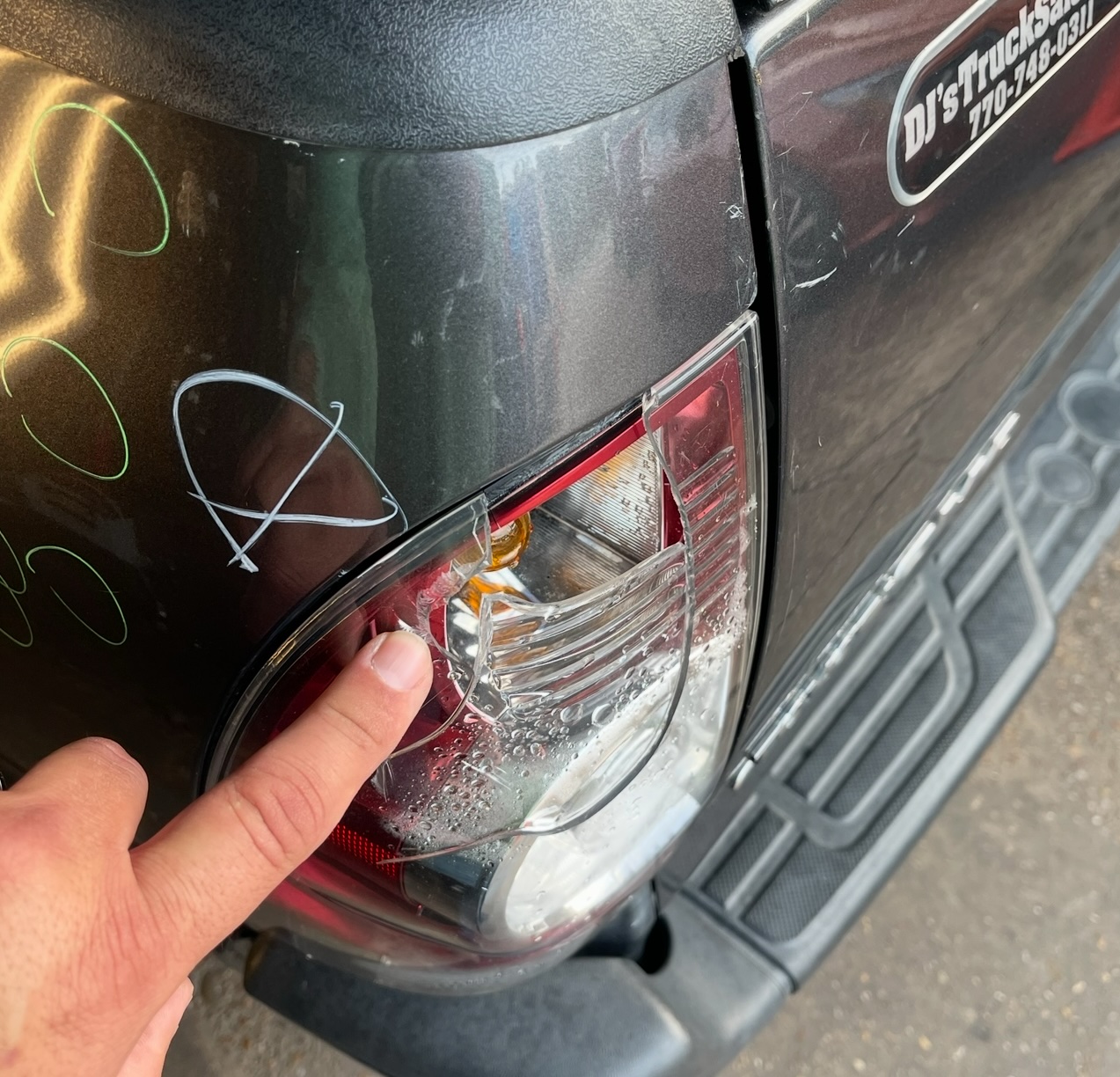 Cracked tail light assembly from hail impact